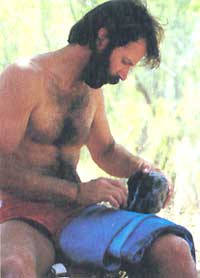 
Wescott examines a chuck of obsidian prior to fracturing it.
